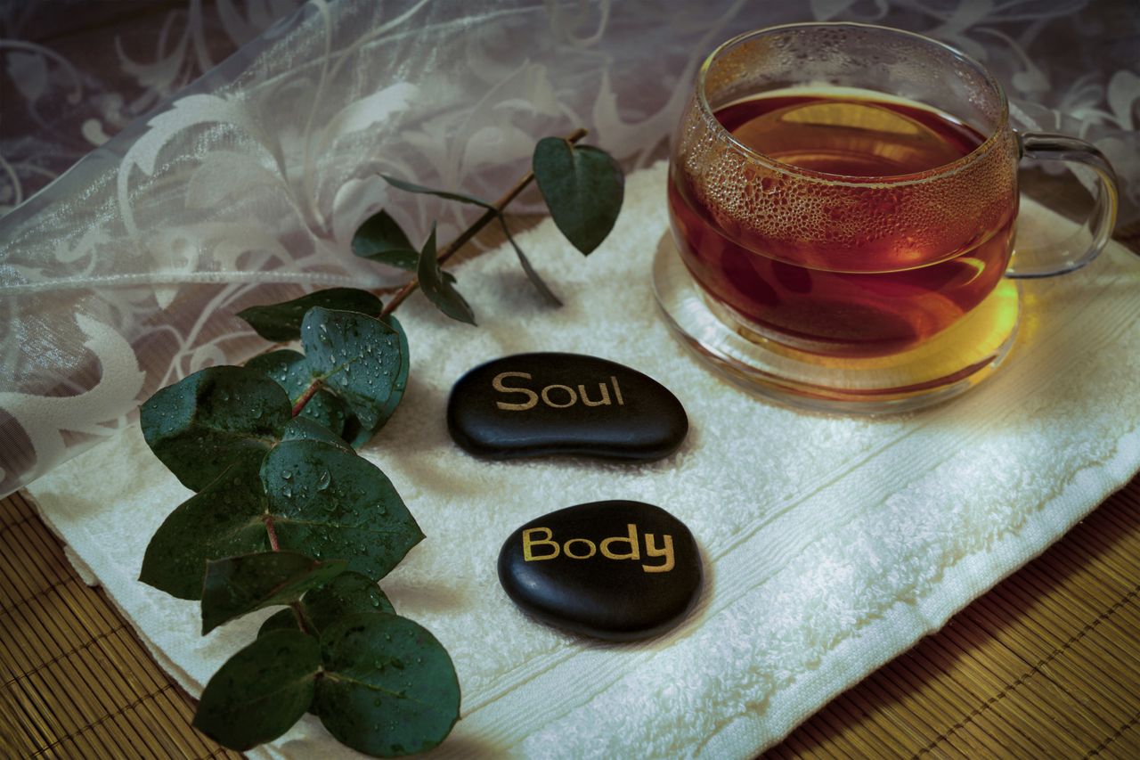 about-us A calming ambiance with eucalyptus, tea, and engraved stones promoting relaxation and wellness.